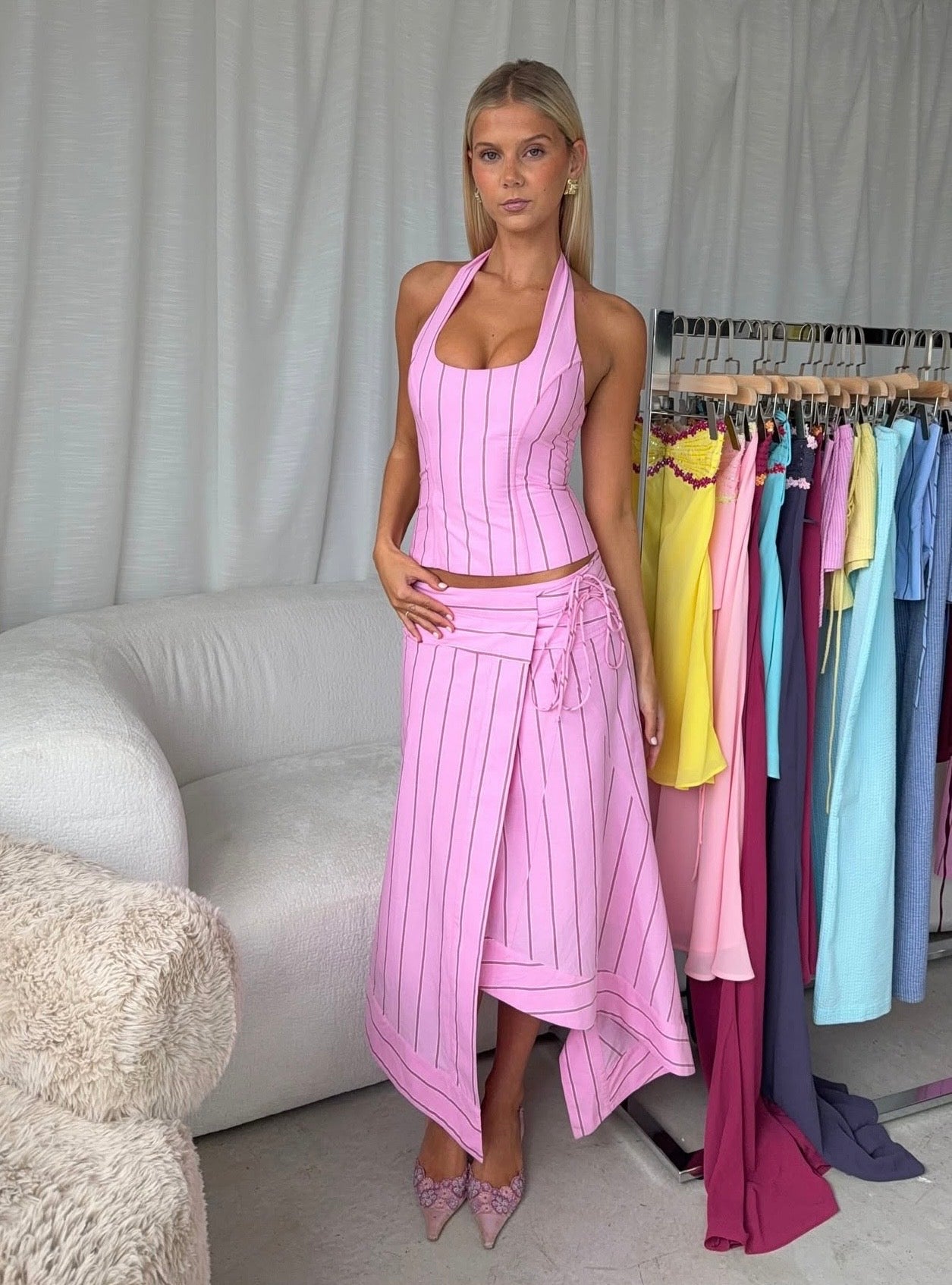 Pink i am delilah sabrina set on a woman standing next to i am delilah garments