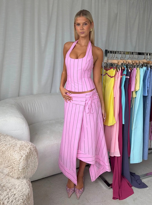 Pink i am delilah sabrina set on a woman standing next to i am delilah garments